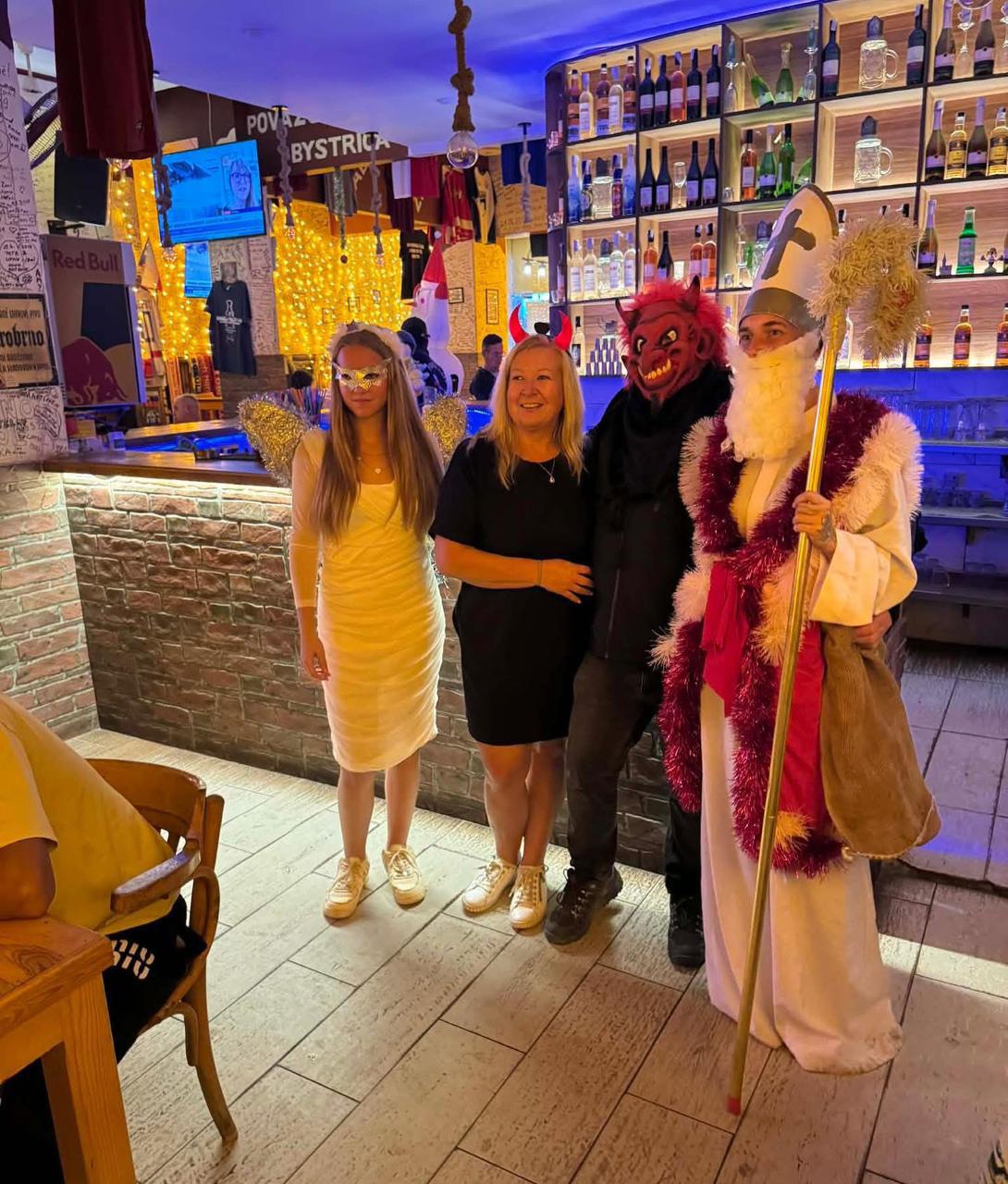 Mikuláš tradition — Saint Nicholas, angel and devil at Praha Cafe